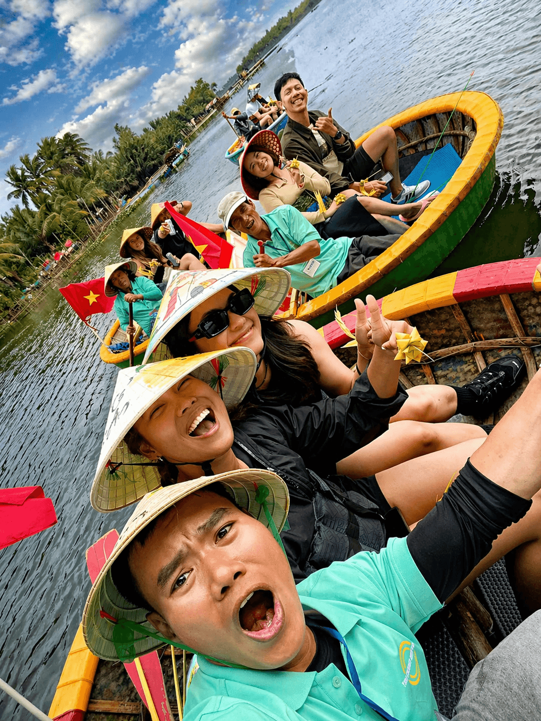 Coconut boat Hoi An tour with happy visitors exploring Bay Mau coconut forest